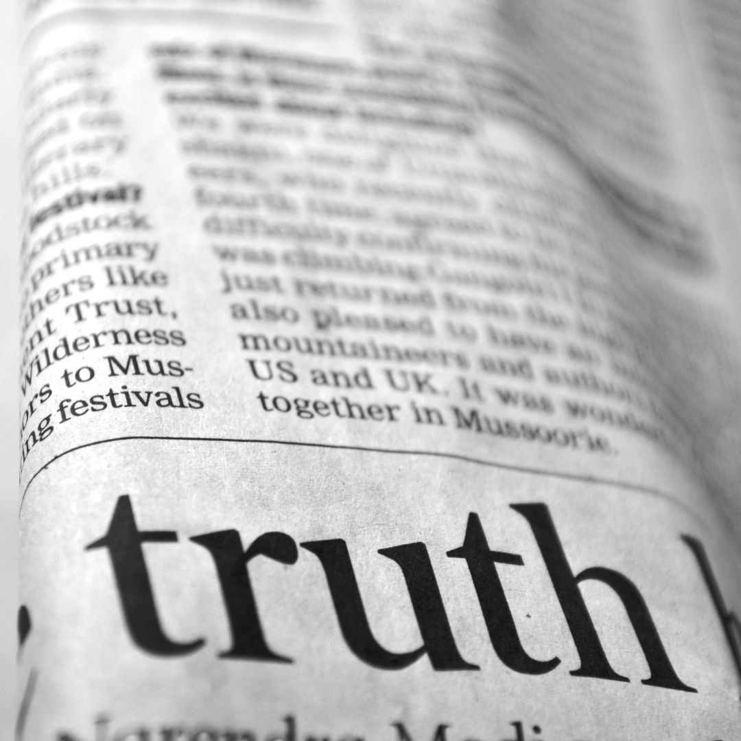 Newspaper with 'truth' highlighted